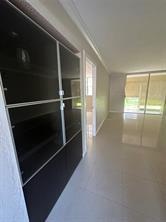 9351 Lime Bay Boulevard, Unit 102 Tamarac, FL 33321 - Photo 12 of 14 a view of an empty room with a window