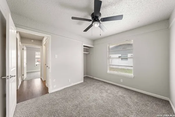 wooden floor in an empty room and a window