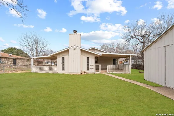 a front view of house with yard and garage