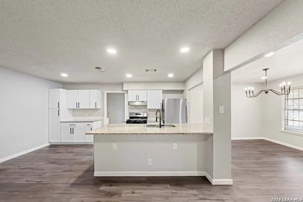 a view of kitchen with wooden floor