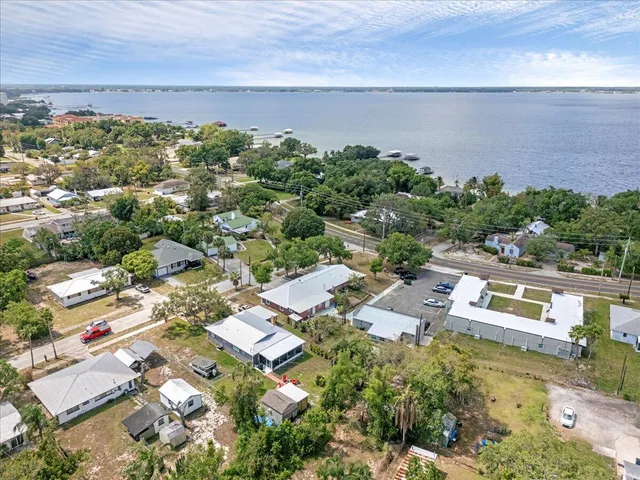an aerial view of a house with a lake view