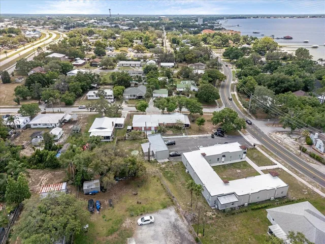 an aerial view of a house with a yard