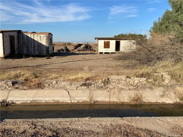 a view of a yard next to a yard