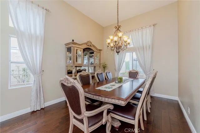 a kitchen with granite countertop a sink stove and cabinets
