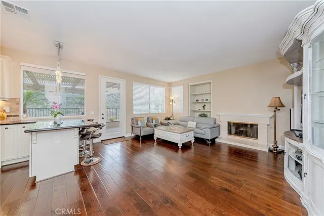 a bathroom with a granite countertop toilet sink and mirror