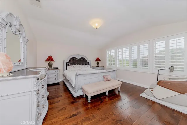 a bathroom with a granite countertop sink and a bathtub