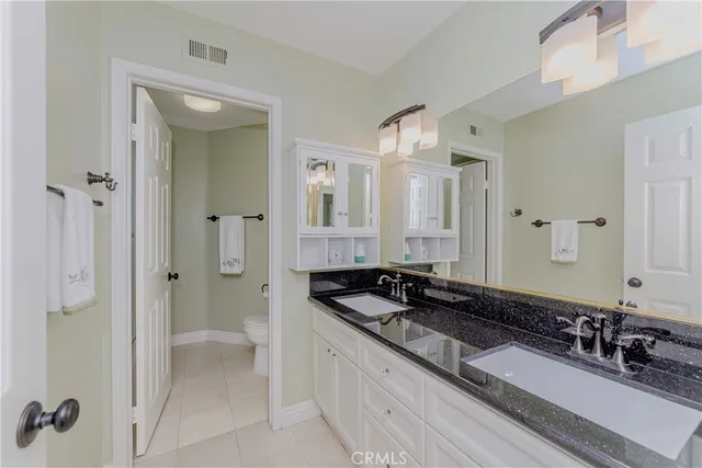 a room with a bed and a night stand