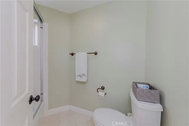 a view of a porch with furniture and a backyard