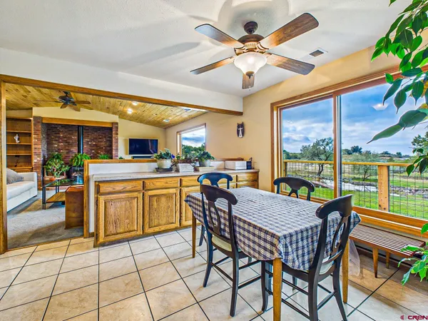 a kitchen with granite countertop cabinets and window