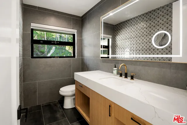 an aerial view of a garden with an outdoor seating