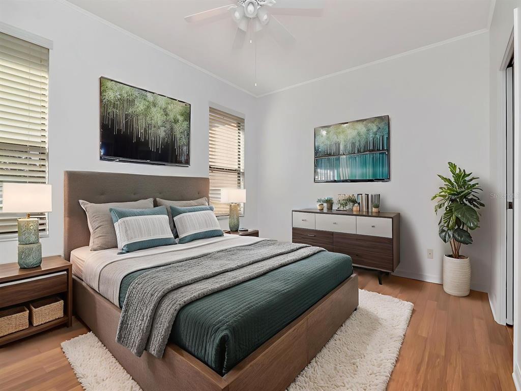 125 Shell Falls Drive Apollo Beach, FL 33572 - Photo 11 of 48 a bedroom with a bed and a potted plant