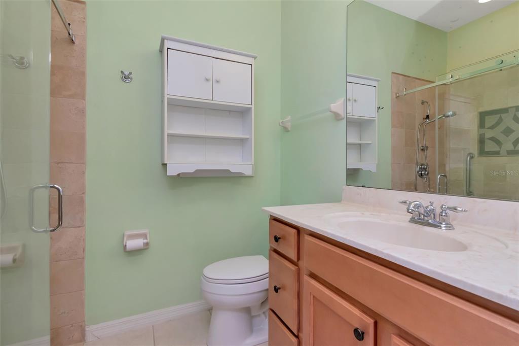 125 Shell Falls Drive Apollo Beach, FL 33572 - Photo 12 of 48 a bathroom with a sink toilet and vanity