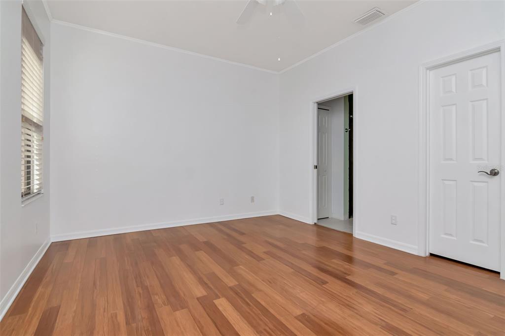 125 Shell Falls Drive Apollo Beach, FL 33572 - Photo 13 of 48 an empty room with wooden floor and windows