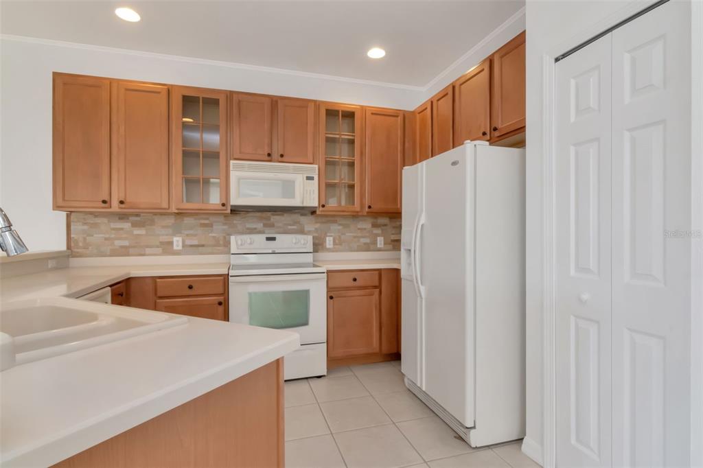 125 Shell Falls Drive Apollo Beach, FL 33572 - Photo 15 of 48 a kitchen with stainless steel appliances granite countertop a refrigerator sink and stove