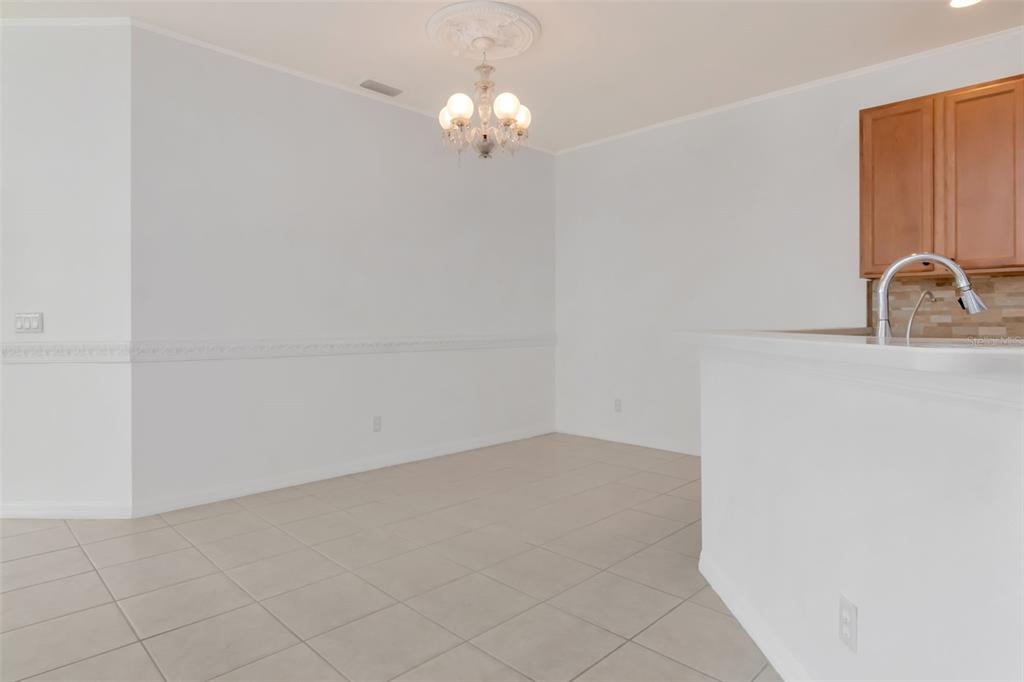 125 Shell Falls Drive Apollo Beach, FL 33572 - Photo 24 of 48 a view of a kitchen with white cabinets