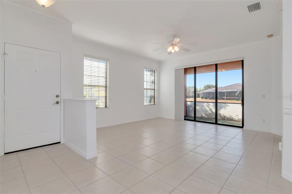 125 Shell Falls Drive Apollo Beach, FL 33572 - Photo 4 of 48 an empty room with windows and closet