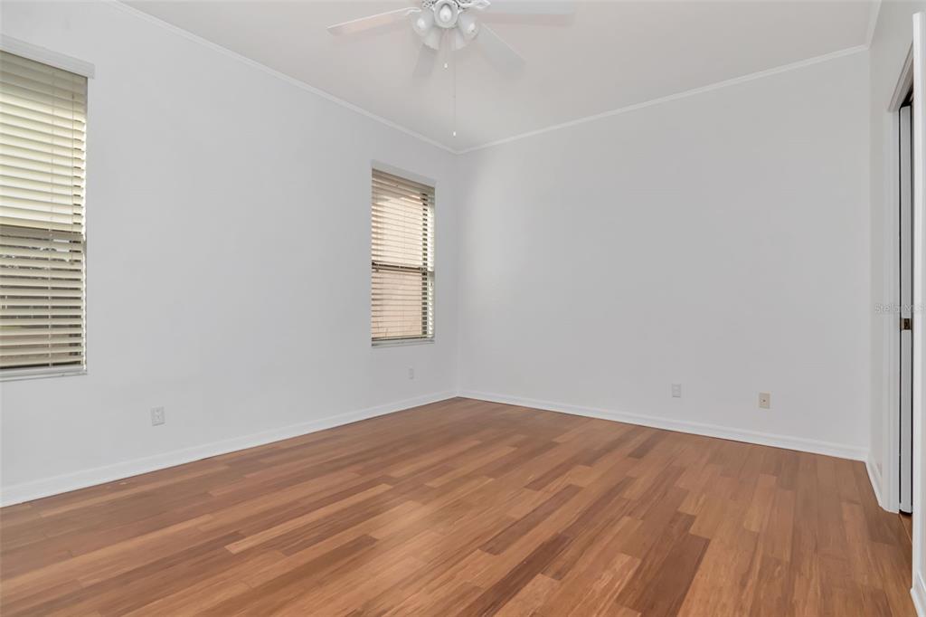 125 Shell Falls Drive Apollo Beach, FL 33572 - Photo 10 of 48 wooden floor in an empty room with a window