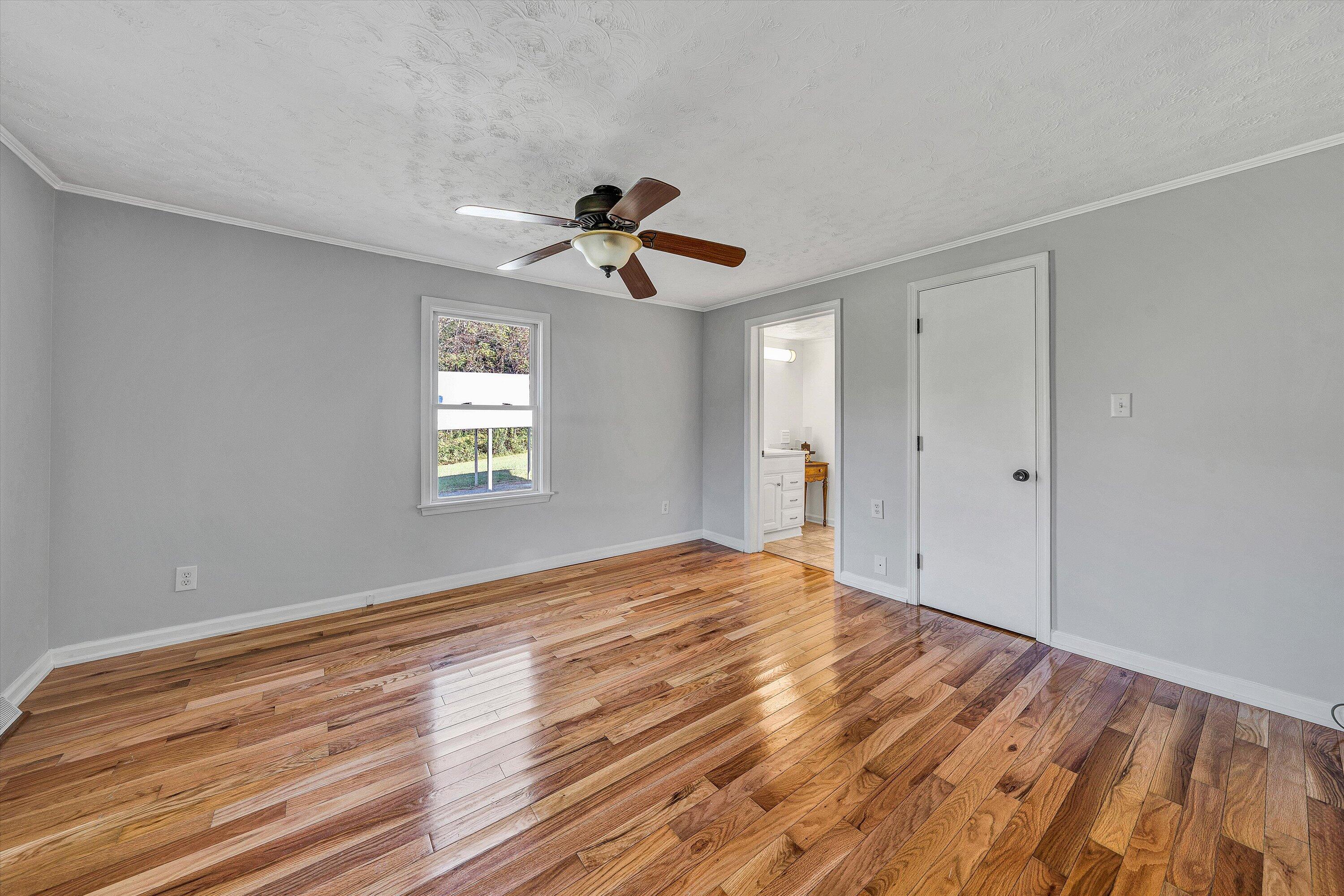 51 Mt Carmel Road Rocky Mount, VA 24151 - Photo 17 of 37 a view of an empty room with window and wooden floor