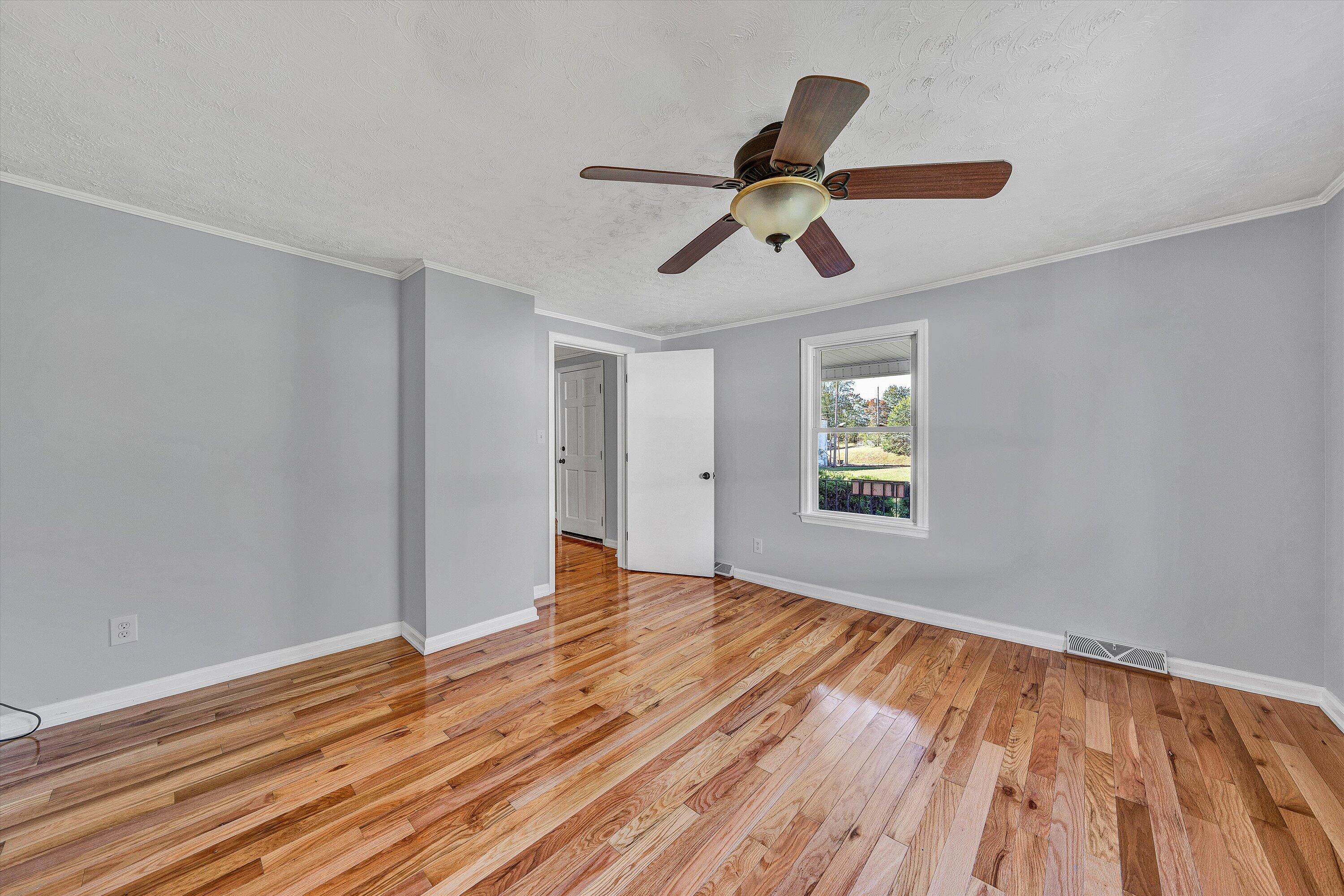 51 Mt Carmel Road Rocky Mount, VA 24151 - Photo 18 of 37 a view of empty room with wooden floor and window