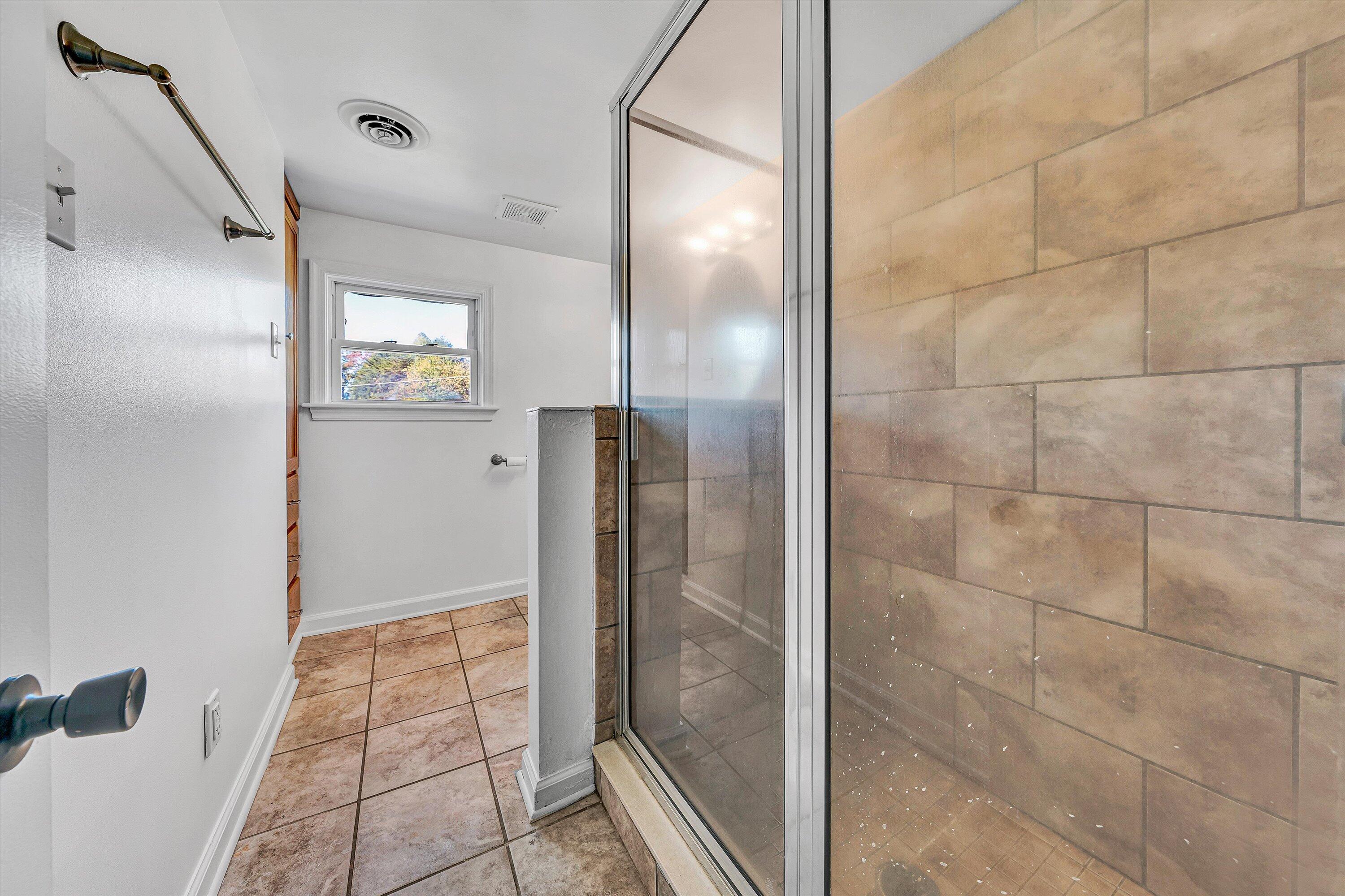 51 Mt Carmel Road Rocky Mount, VA 24151 - Photo 21 of 37 a bathroom with a shower and a mirror