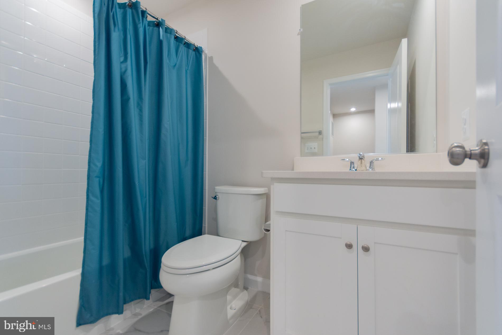 50 Coolidge Avenue Ranson, WV 25438 - Photo 19 of 47 a bathroom with a sink a toilet and shower