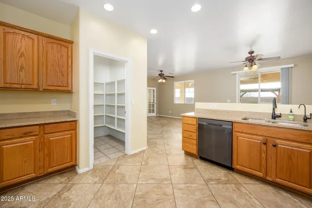 a large bathroom with a sink and a large mirror