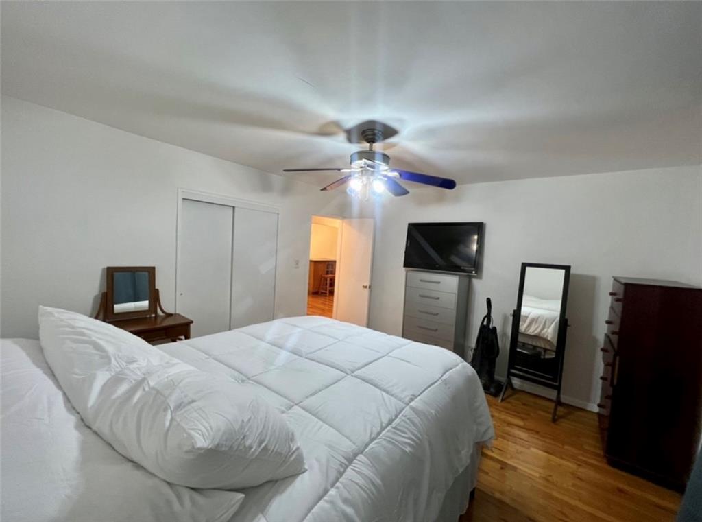 275 Webster Avenue, Unit 3A Brooklyn, NY 11230 - Photo 11 of 20 a bedroom with a bed and a flat screen tv