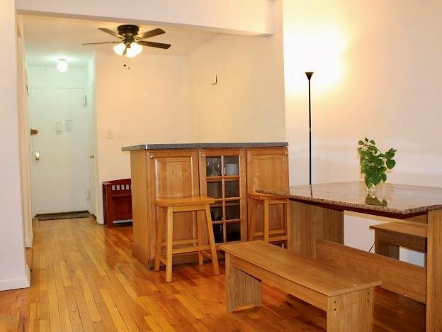 275 Webster Avenue, Unit 3A Brooklyn, NY 11230 - Photo 17 of 20 a view of a room with a table and chairs