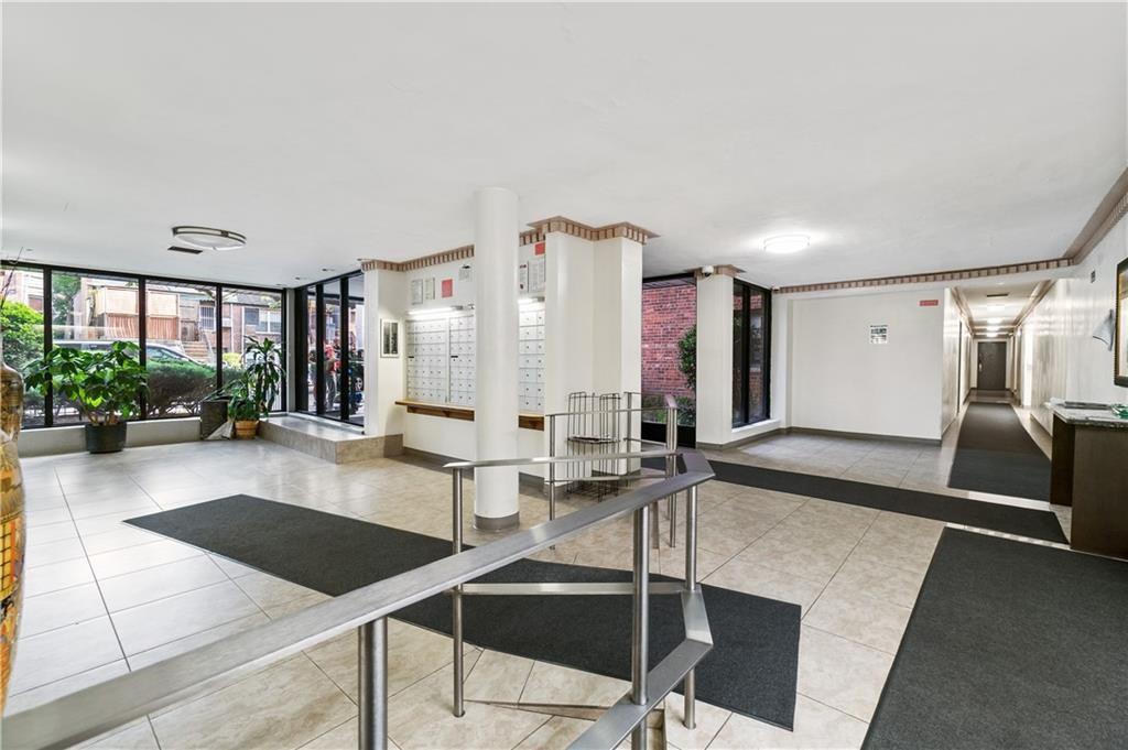 275 Webster Avenue, Unit 3A Brooklyn, NY 11230 - Photo 19 of 20 a room with lots of furniture and a large window