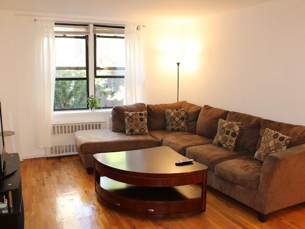 275 Webster Avenue, Unit 3A Brooklyn, NY 11230 - Photo 5 of 20 a living room with furniture and a window