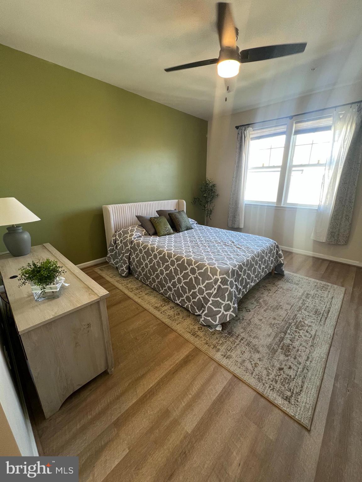 3106 Laurel Hill Road Hanover, MD 21076 - Photo 11 of 25 a bedroom with a bed and a chandelier