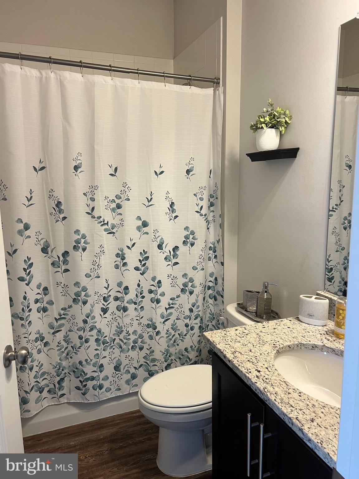 3106 Laurel Hill Road Hanover, MD 21076 - Photo 17 of 25 a bathroom with a granite countertop sink and a toilet