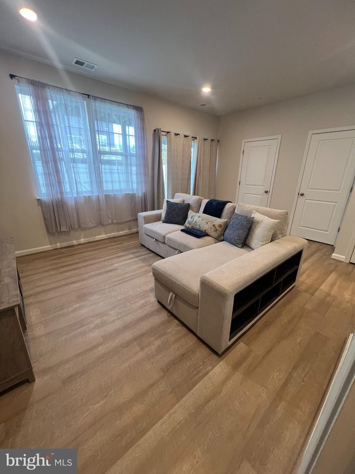 3106 Laurel Hill Road Hanover, MD 21076 - Photo 20 of 25 a living room with furniture and a window