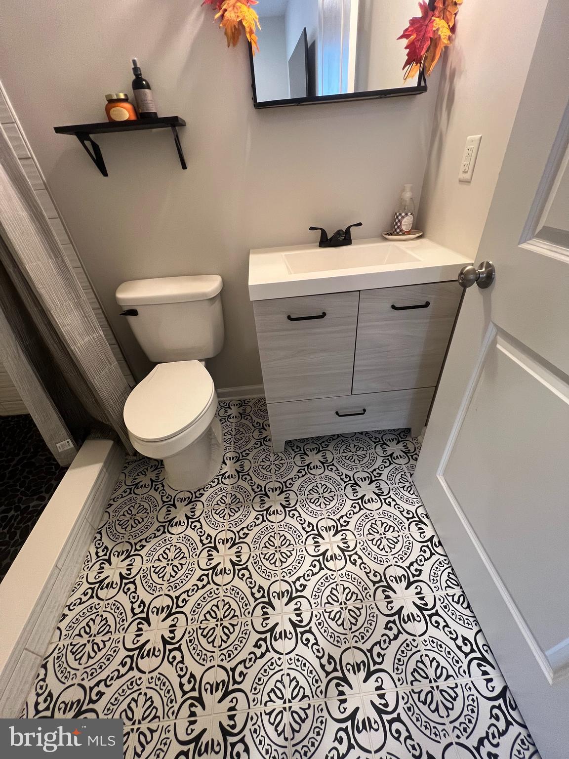 3106 Laurel Hill Road Hanover, MD 21076 - Photo 23 of 25 a bathroom with a toilet and a sink