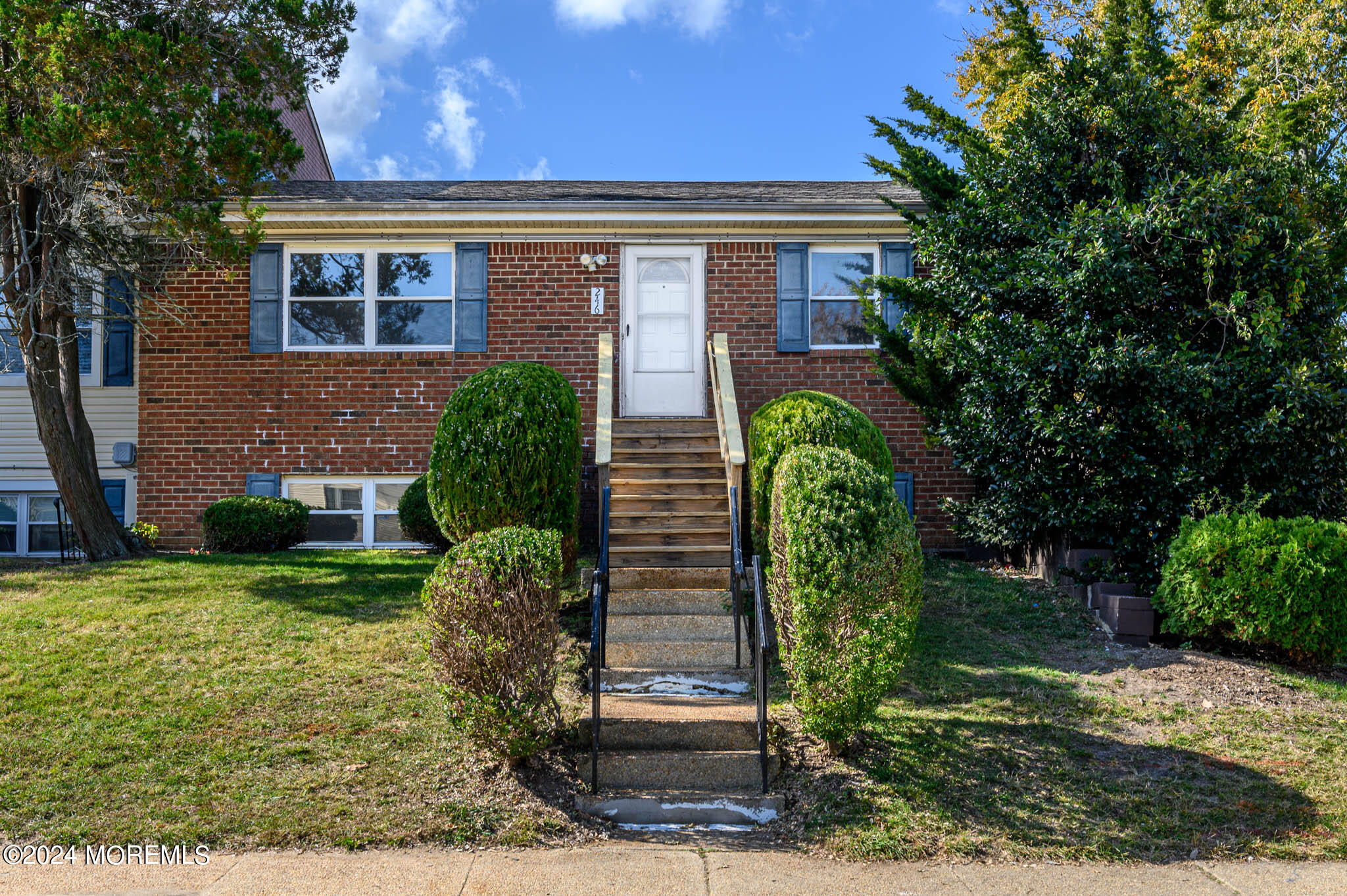 246 Sawmill Road, Unit 403 Brick, NJ 08724 - Photo 1 of 41 a front view of a house with garden