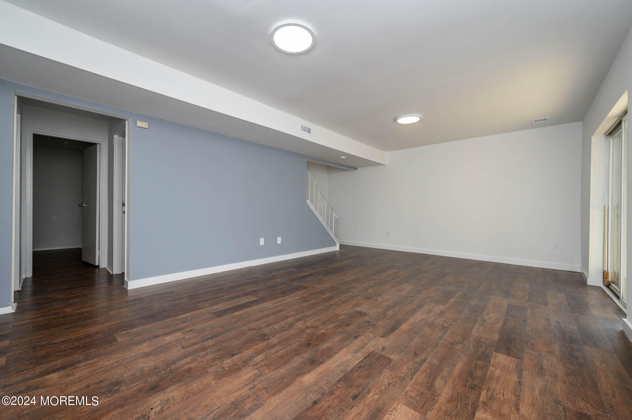 246 Sawmill Road, Unit 403 Brick, NJ 08724 - Photo 30 of 41 a view of an empty room with wooden floor