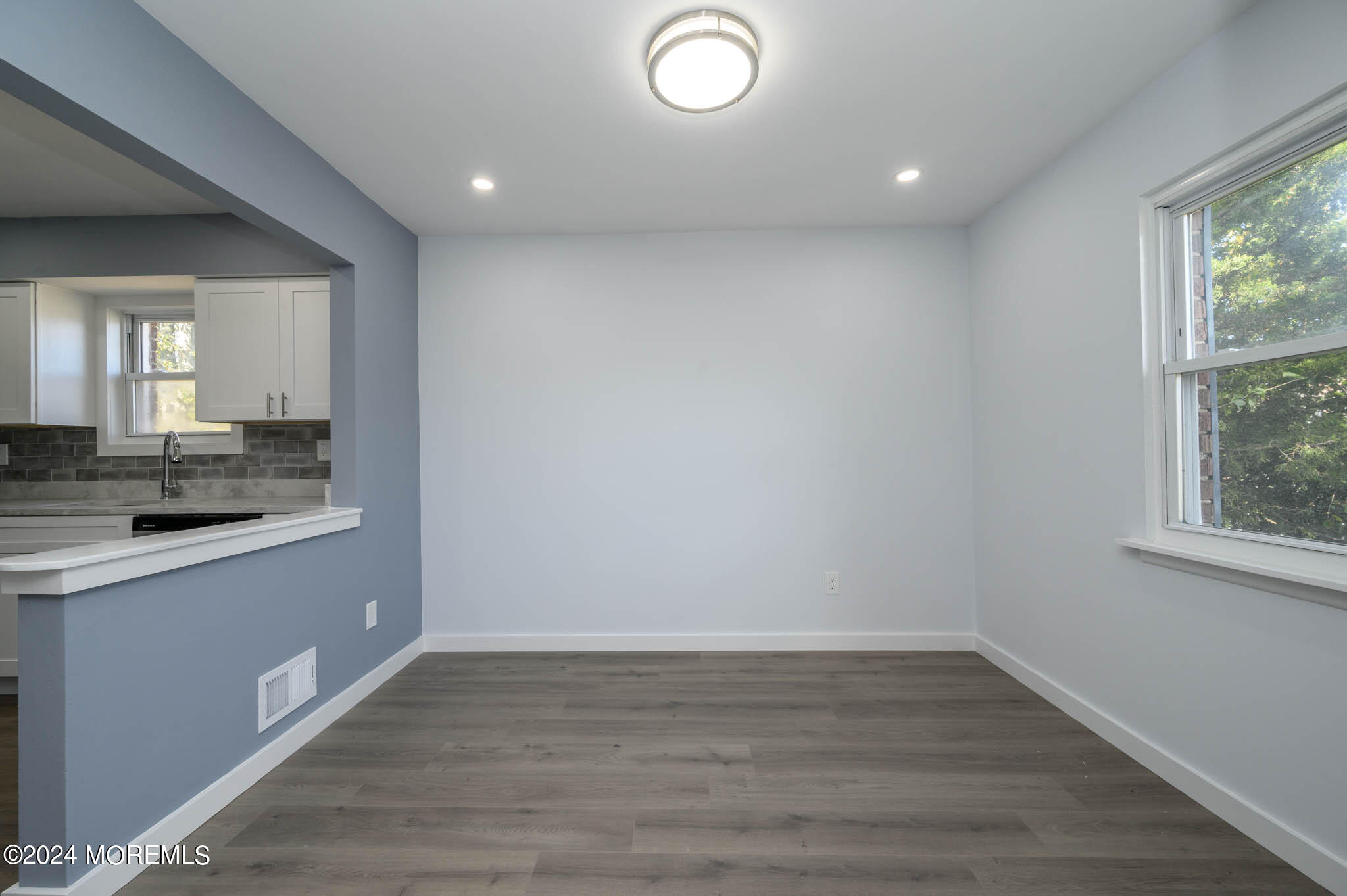 246 Sawmill Road, Unit 403 Brick, NJ 08724 - Photo 4 of 41 a view of a kitchen with a sink and wooden floor