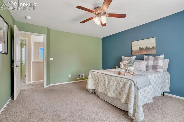 an empty room with closet and a bathroom