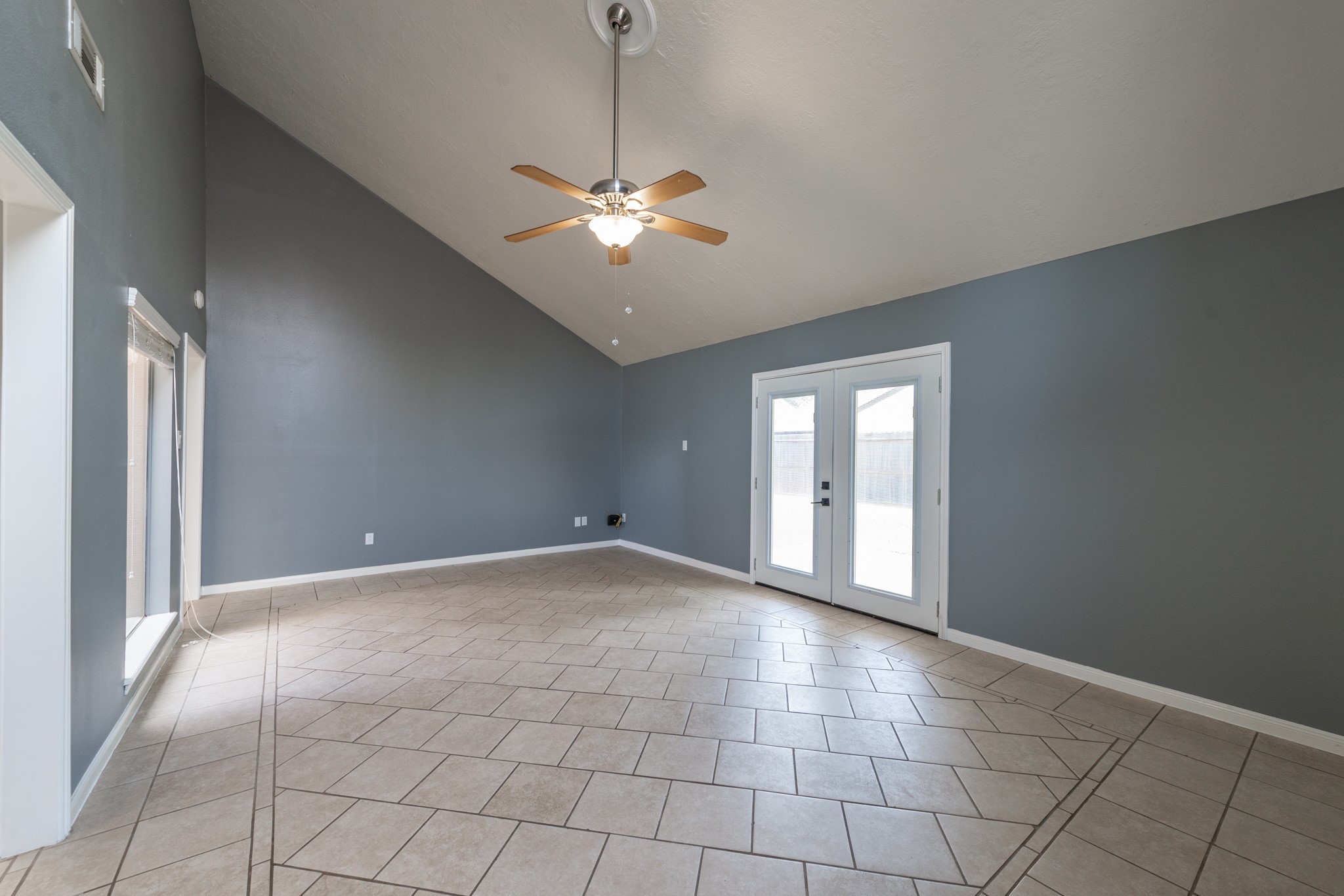 1022 White Sands Road Katy, TX 77450 - Photo 7 of 27 Vaulted ceiling in living room with upgraded French doors leading to backyard.