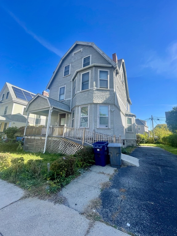 20 Rill Street Boston, MA 02125 - Photo 1 of 20 a front view of a house with a garden