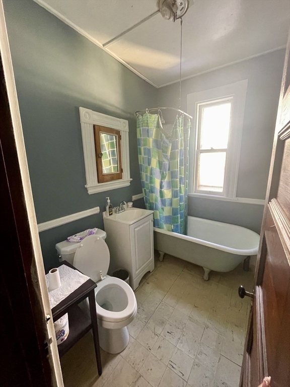 20 Rill Street Boston, MA 02125 - Photo 11 of 20 a bathroom with a toilet a sink and a bathtub