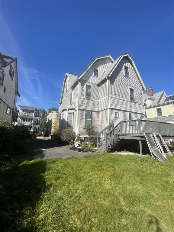 20 Rill Street Boston, MA 02125 - Photo 20 of 20 a front view of a house with garden