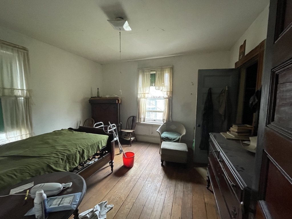 20 Rill Street Boston, MA 02125 - Photo 10 of 20 a bedroom with furniture and a flat screen tv