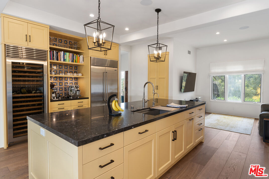 2382 Live Oak Meadows Road Malibu, CA 90265 - Photo 15 of 50 a kitchen with stainless steel appliances granite countertop a sink a oven and a counter space