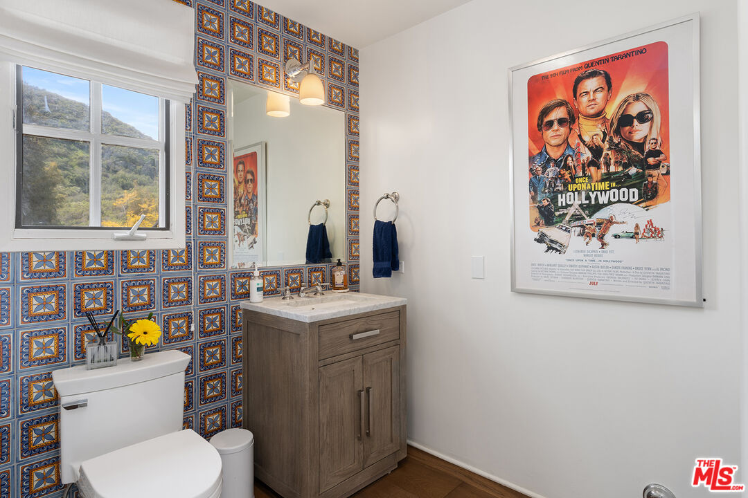 2382 Live Oak Meadows Road Malibu, CA 90265 - Photo 18 of 50 a bathroom with a toilet sink and mirror