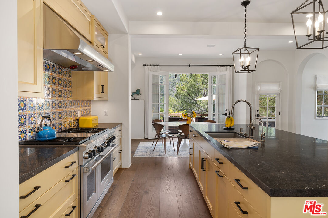 2382 Live Oak Meadows Road Malibu, CA 90265 - Photo 20 of 50 a kitchen with stainless steel appliances granite countertop a sink stove and cabinets