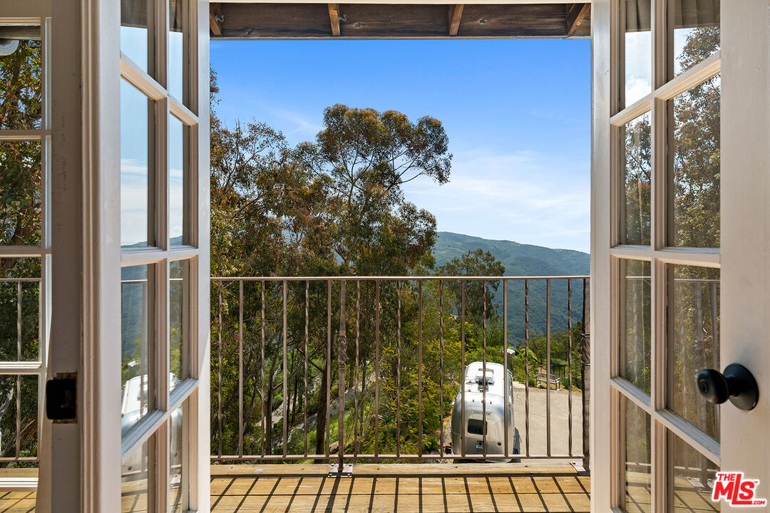 2382 Live Oak Meadows Road Malibu, CA 90265 - Photo 25 of 50 a view of a balcony with an outdoor space