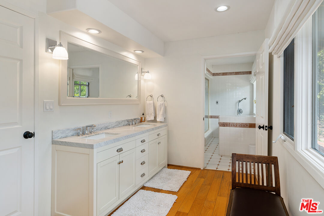 2382 Live Oak Meadows Road Malibu, CA 90265 - Photo 27 of 50 a bathroom with a sink a mirror and a shower