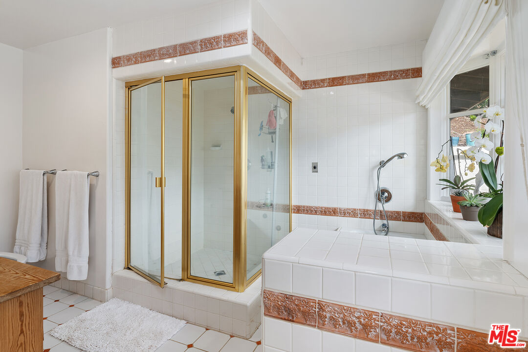 2382 Live Oak Meadows Road Malibu, CA 90265 - Photo 28 of 50 a bathroom with a tub and a sink