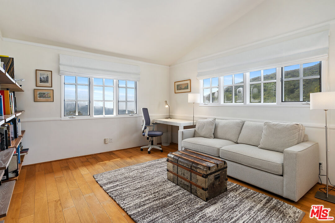 2382 Live Oak Meadows Road Malibu, CA 90265 - Photo 31 of 50 a living room with furniture and a window